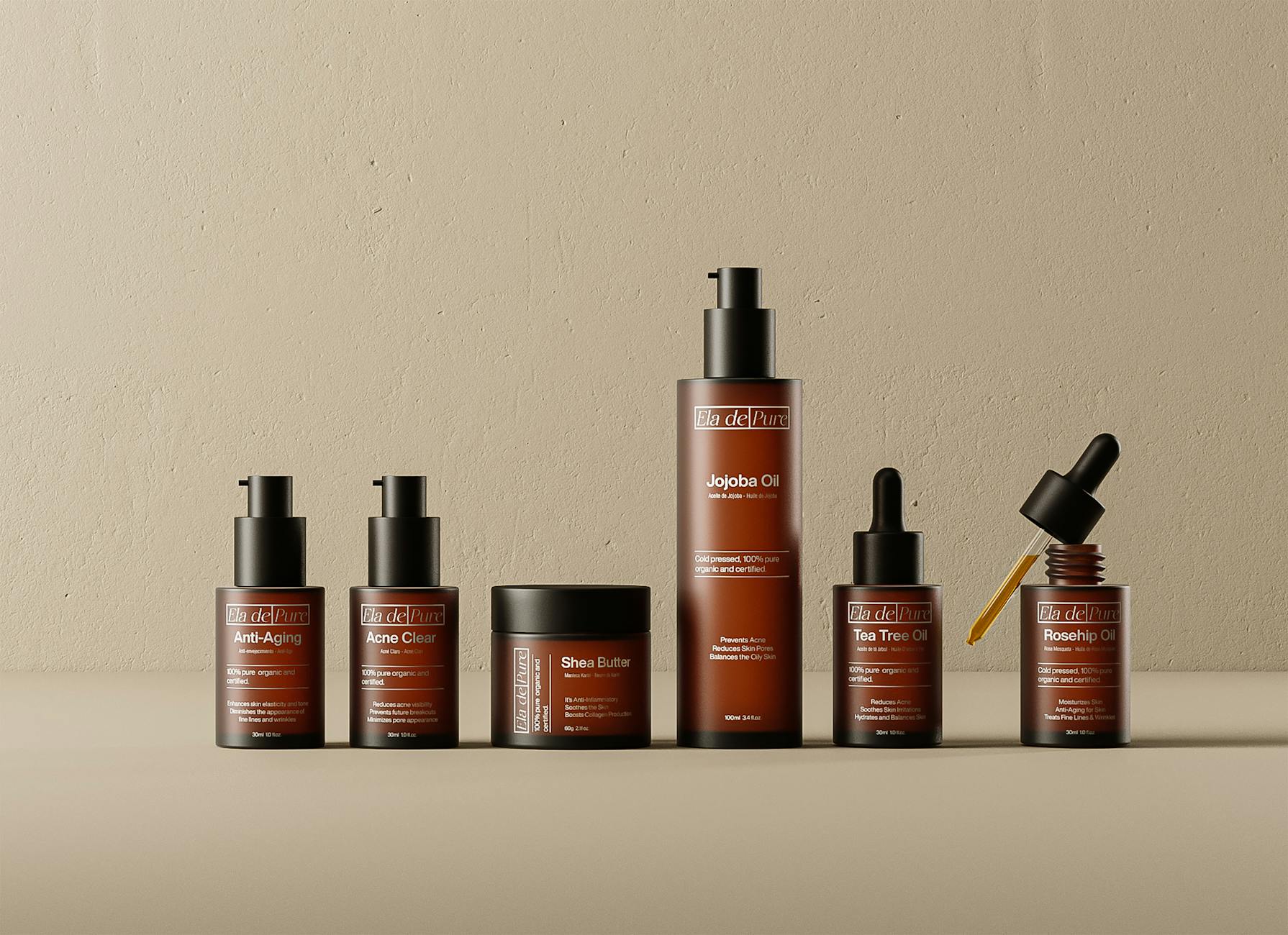 Kosmetyki Ela de Pure z olejkami i serum ustawione na blacie